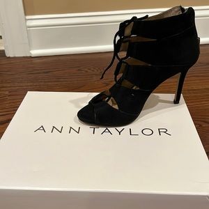 Black suede lace up peep tie bootie size 6 zip in back worn once in box.